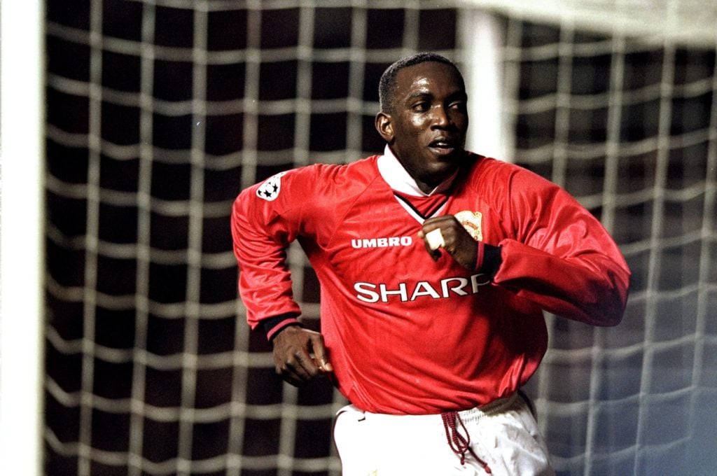 Dwight Yorke of Manchester United celebrates a goal against Inter Milan during the UEFA Champions League quarter-final first leg match at Old Traff...