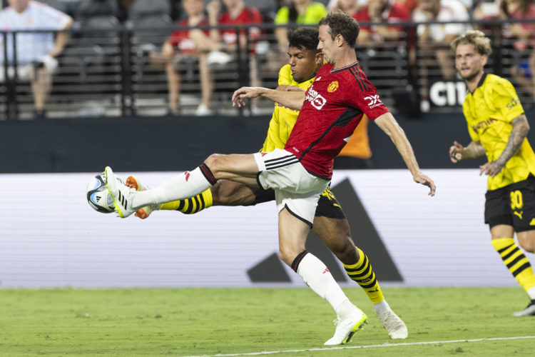 Paul Besong of Borussia Dortmund and Jonny Evans of Manchester United battle for the ball during the pre-season friendly match between Manchester U...