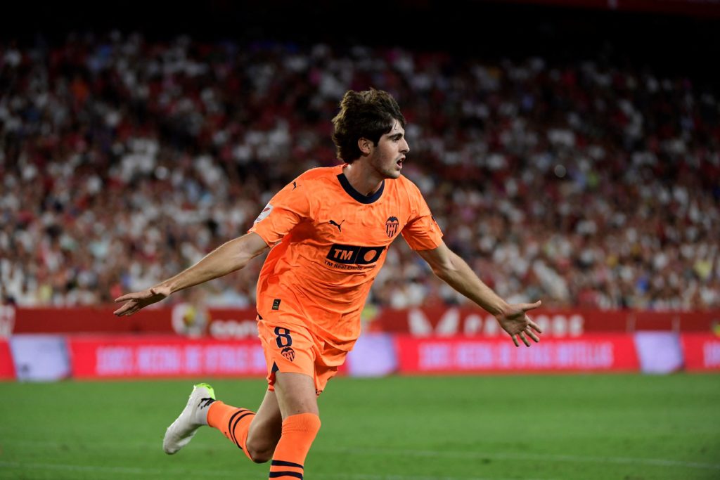 Valencia midfielder Javi Guerra celebrates scoring against Sevilla.