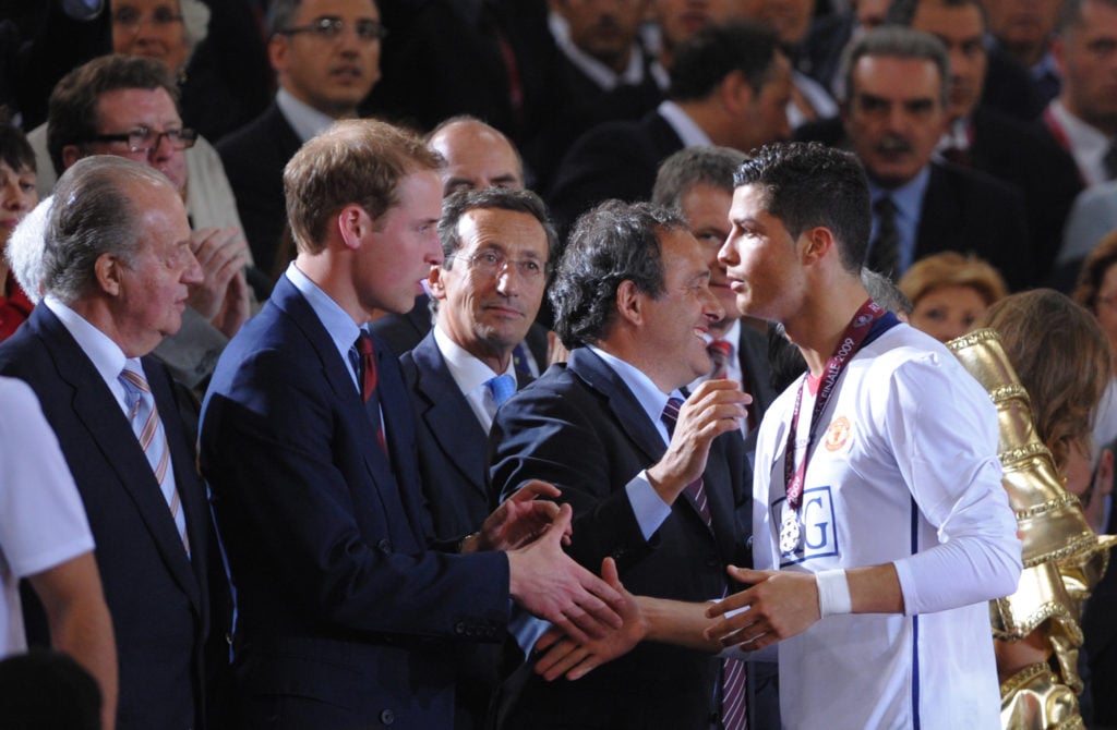 Prince William shakes hands Cristiano Ronaldo of Manchester United as he receives his runners up medal in the UEFA Champions League Final match bet...