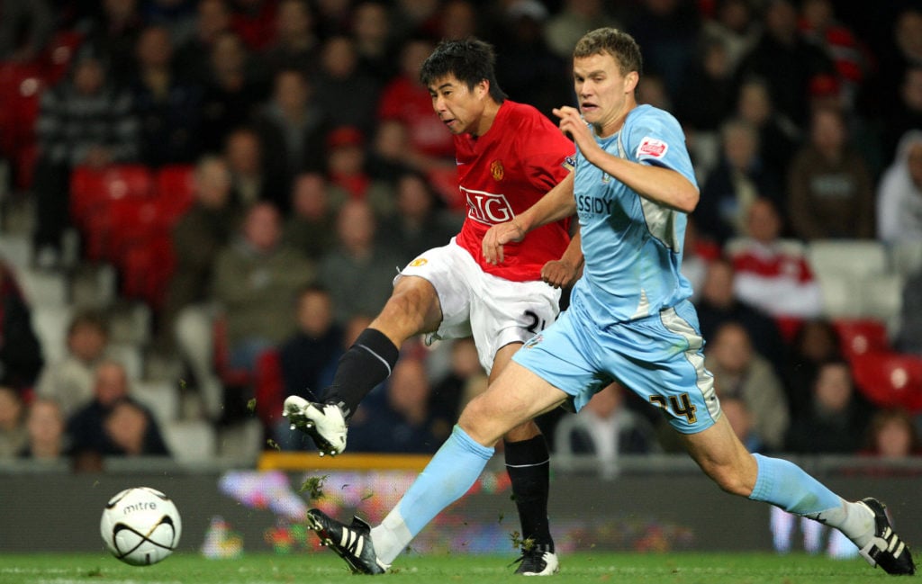 Dong Fangzhuo (L) of Manchester United f