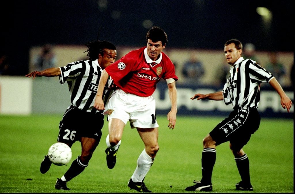 Roy Keane of Manchester United gets past Edgar Davids and Gianluca Pessotto of Juventus in the UEFA Champions League semi-final second leg match at...