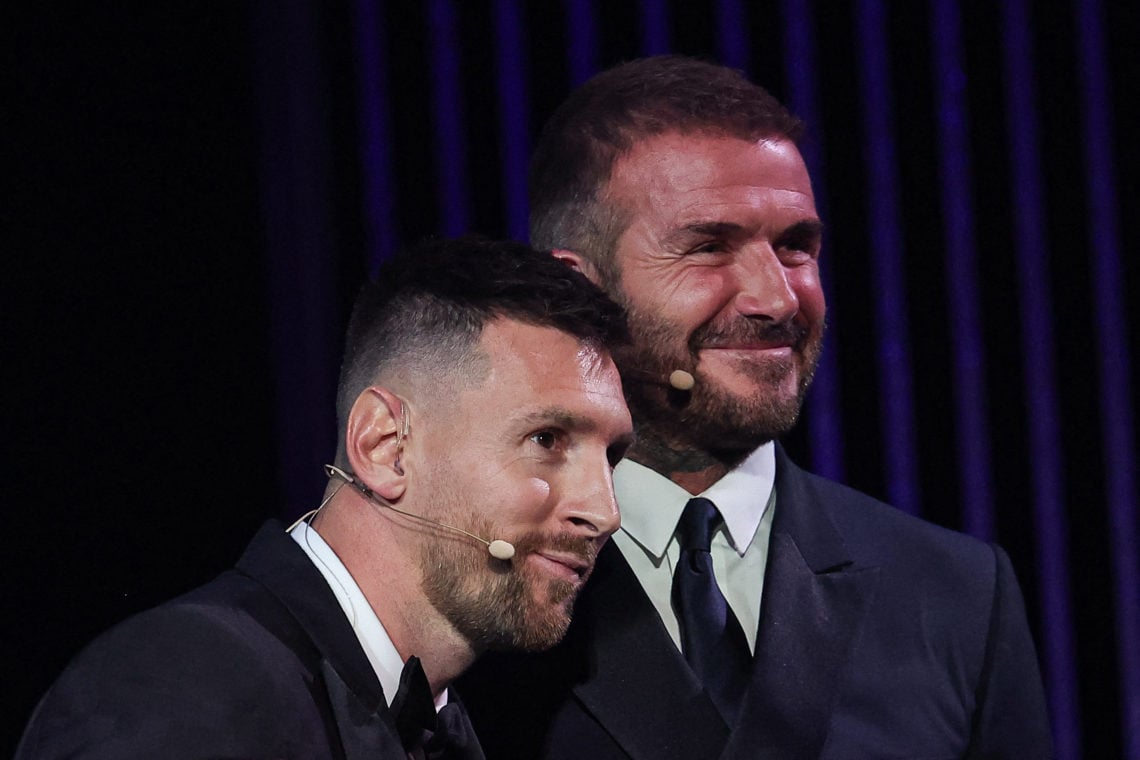 Inter Miami CF's Argentine forward Lionel Messi (L) reacts on stage as he receives his 8th Ballon d'Or award next to Former English football player...