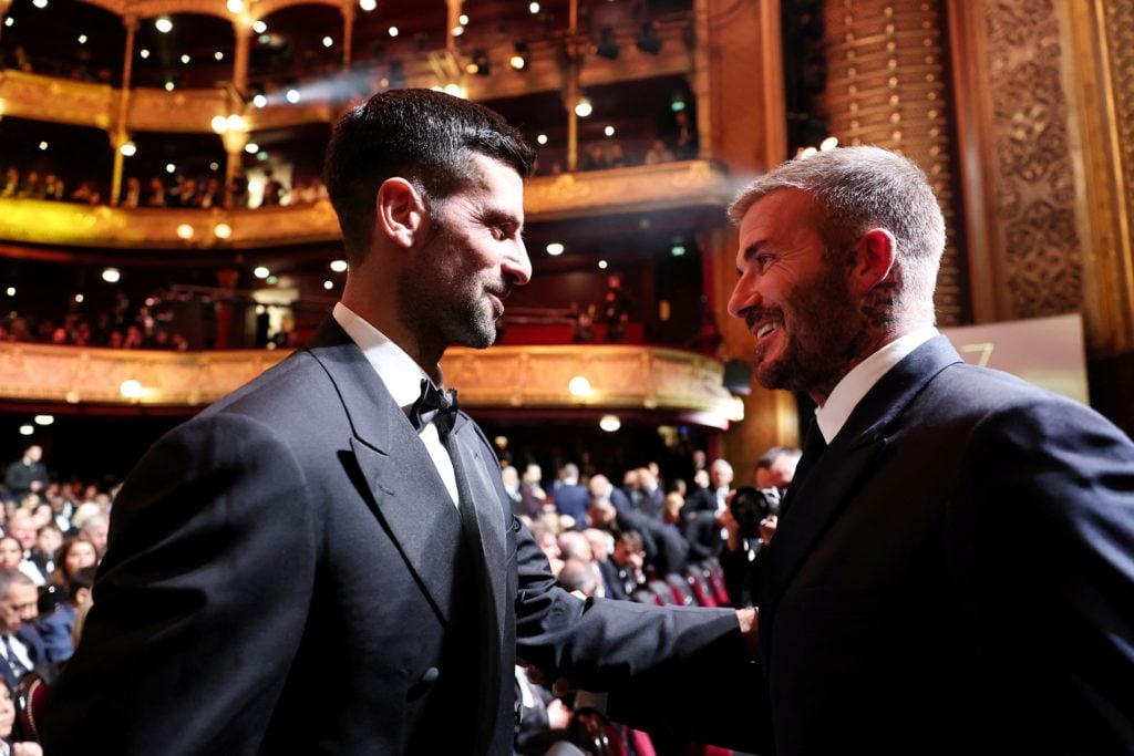 Serbian tennis player Novak Djokovic (L) speaks with Inter Miami's co-owner David Beckham as they attend the 2023 Ballon d'Or France Football award...