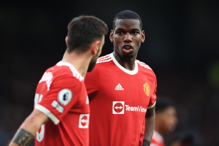 Paul Pogba of Manchester United talks to Bruno Fernandes of Manchester United during the Premier League match between Manchester United and Leicest...