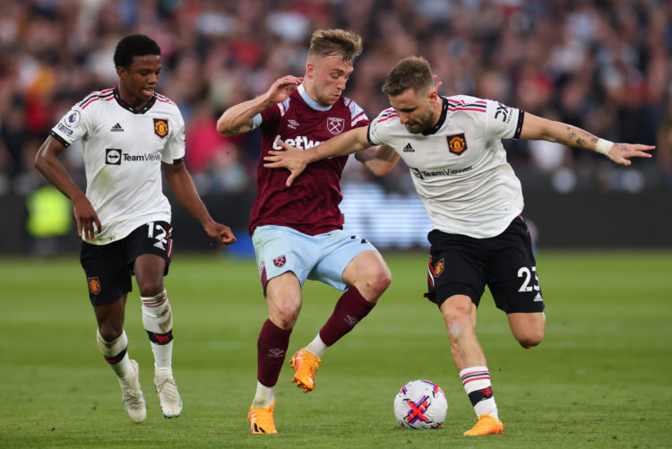 LONDON, ENGLAND - MAY 7: Jarrod Bowen of West Ham in action with Tyrell Malacia and Luke Shaw of Manchester United during the Premier League match ...