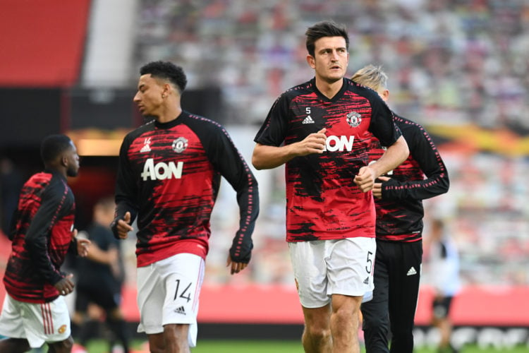 Jesse Lingard and Harry Maguire of Manchester United warm up prior to during the UEFA Europa League round of 16 second leg match between Manchester...