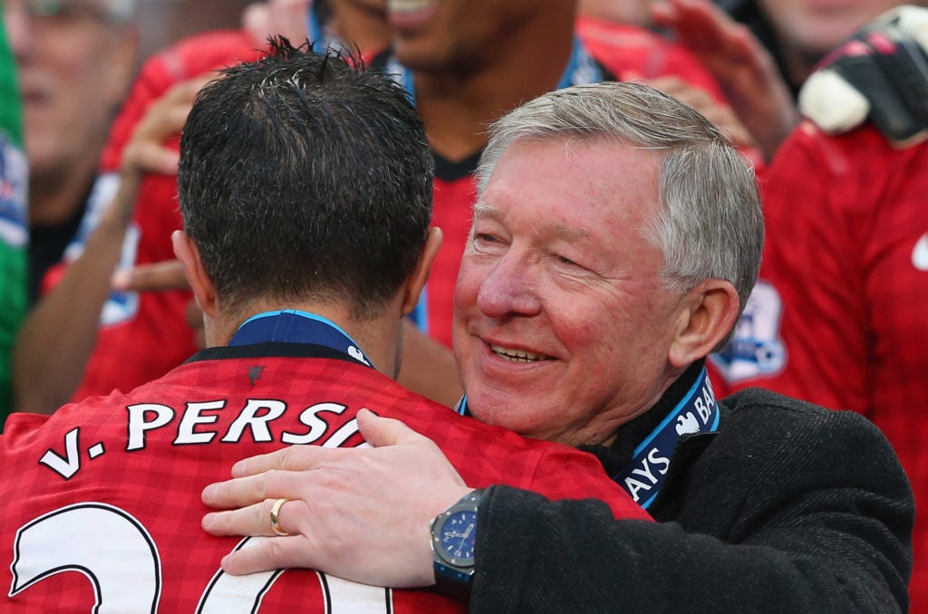 Manchester United Manager Sir Alex Ferguson congratulates Robin van Persie following the Barclays Premier League match between Manchester United an...