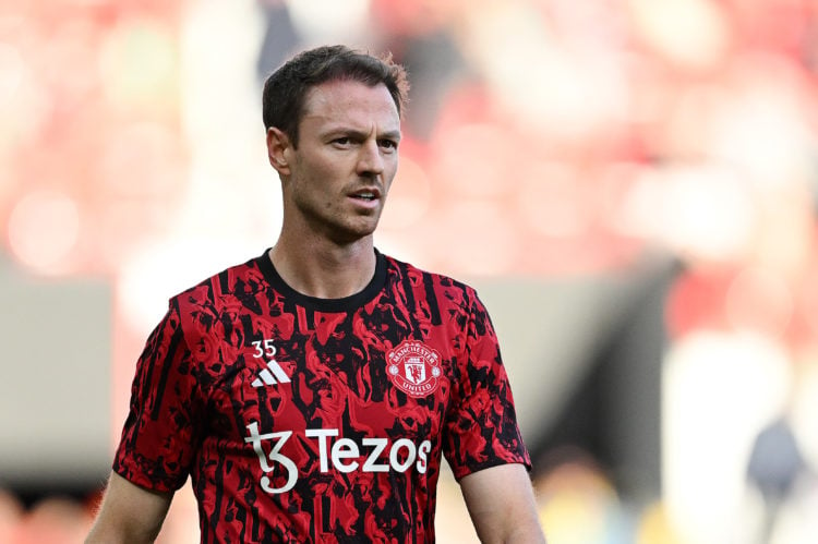 Jonny Evans of Manchester United looks on in the warm up prior to the Premier League match between Manchester United and Manchester City at Old Tra...