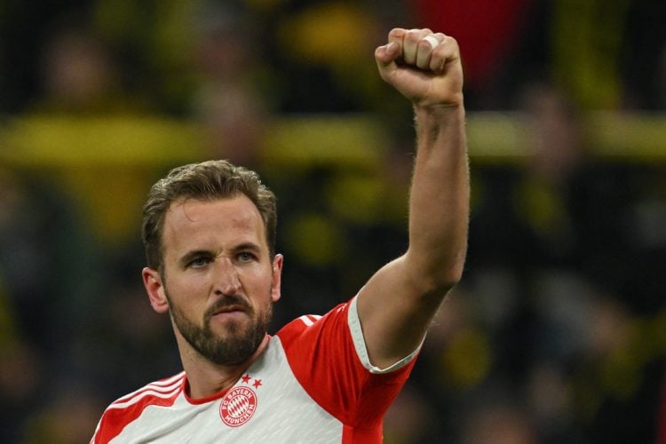 TOPSHOT - Bayern Munich's English forward #09 Harry Kane celebrates scoring the 0-3 goal during the German first division Bundesliga football match...