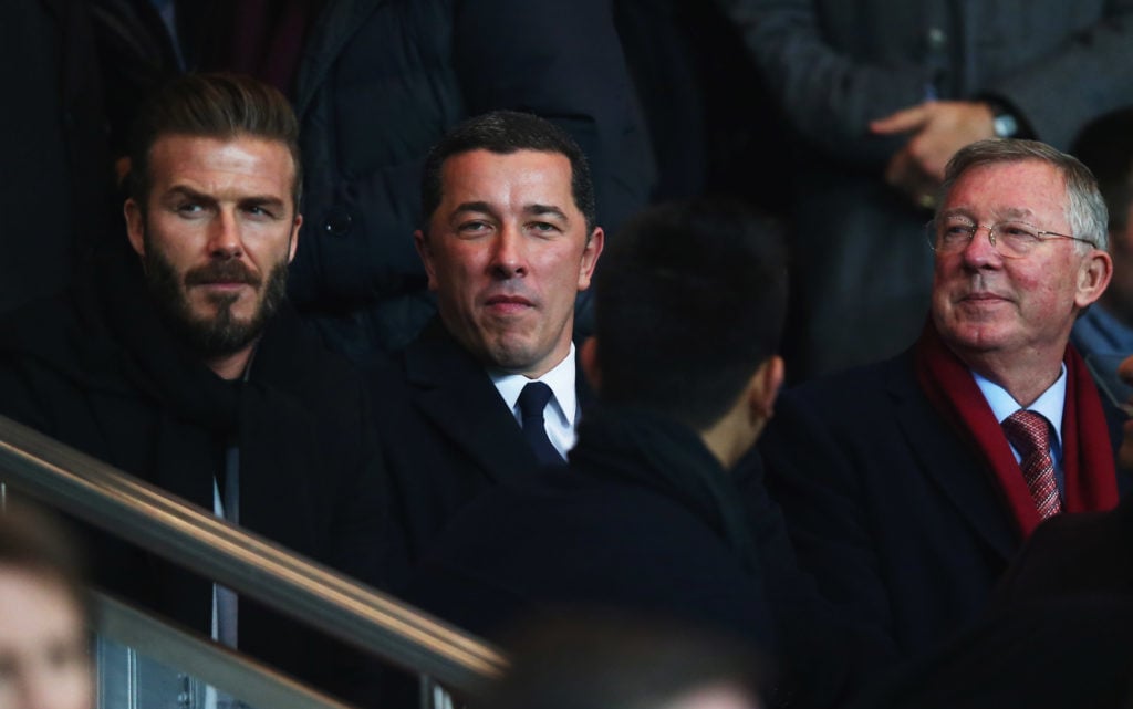 Ex-PSG player David Beckham (L) and Sir Alex Ferguson (R) look on prior to the UEFA Champions League Round of 16 match between Paris Saint-Germain ...