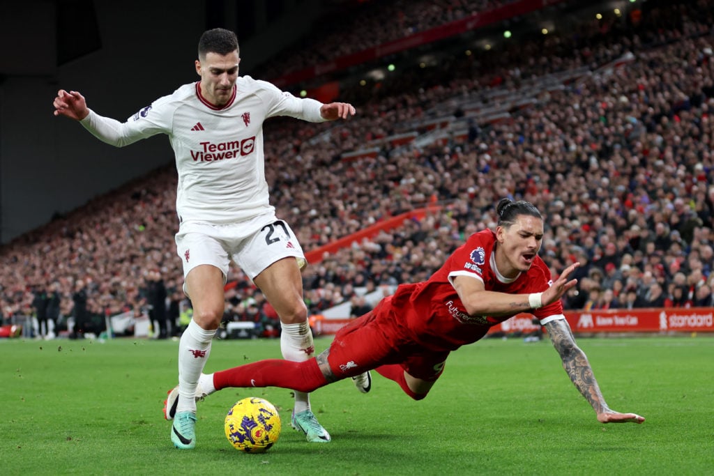 Diogo Dalot of Manchester United battles for possession with Darwin Nunez of Liverpool during the Premier League match between Liverpool FC and Man...