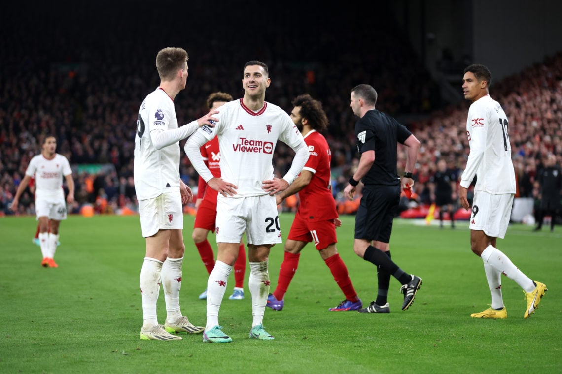 Diogo Dalot of Manchester United reacts after being red carded for dissent during the Premier League match between Liverpool FC and Manchester Unit...