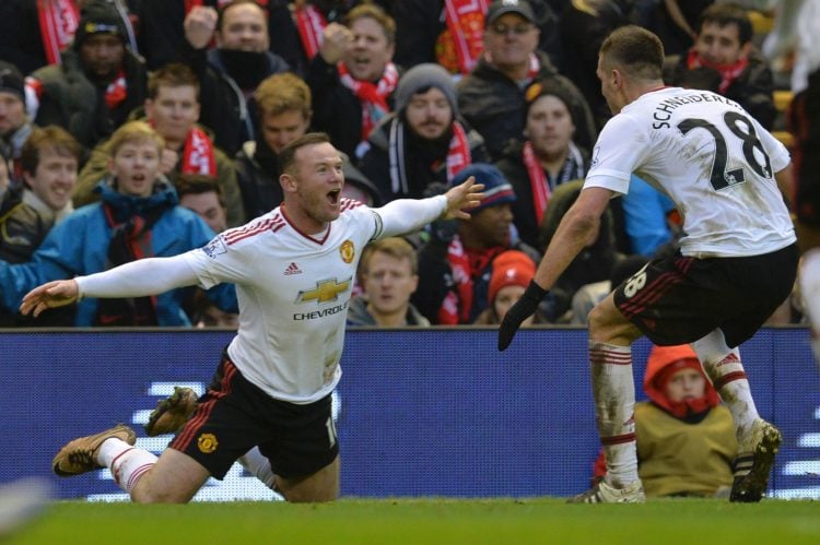 TOPSHOT - Manchester United's English striker Wayne Rooney (L) celebrates scoring the opening goal during the English Premier League football match...