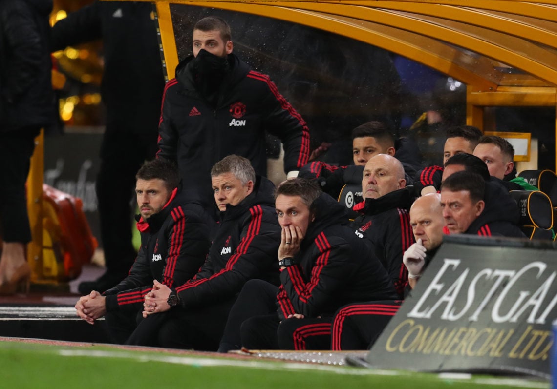 Ole Gunnar Solskjaer interim manager of Manchester United watches the match from the bench alongside Michael Carrick, David de Gea, Mike Phelan and...