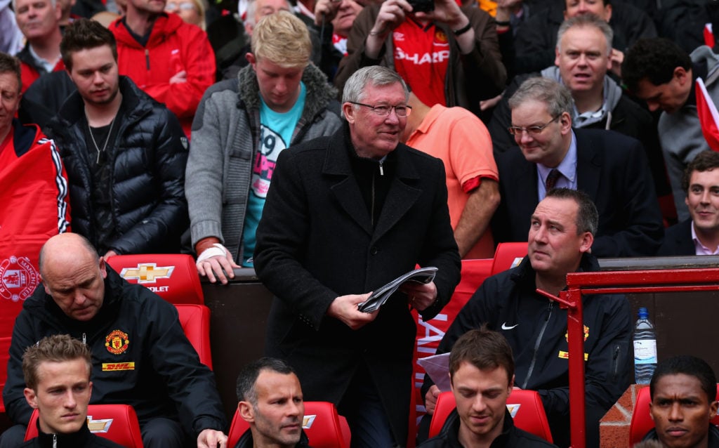 Manchester United Manager Sir Alex Ferguson takes his seat in the dugout for the last time prior to the Barclays Premier League match between Manch...