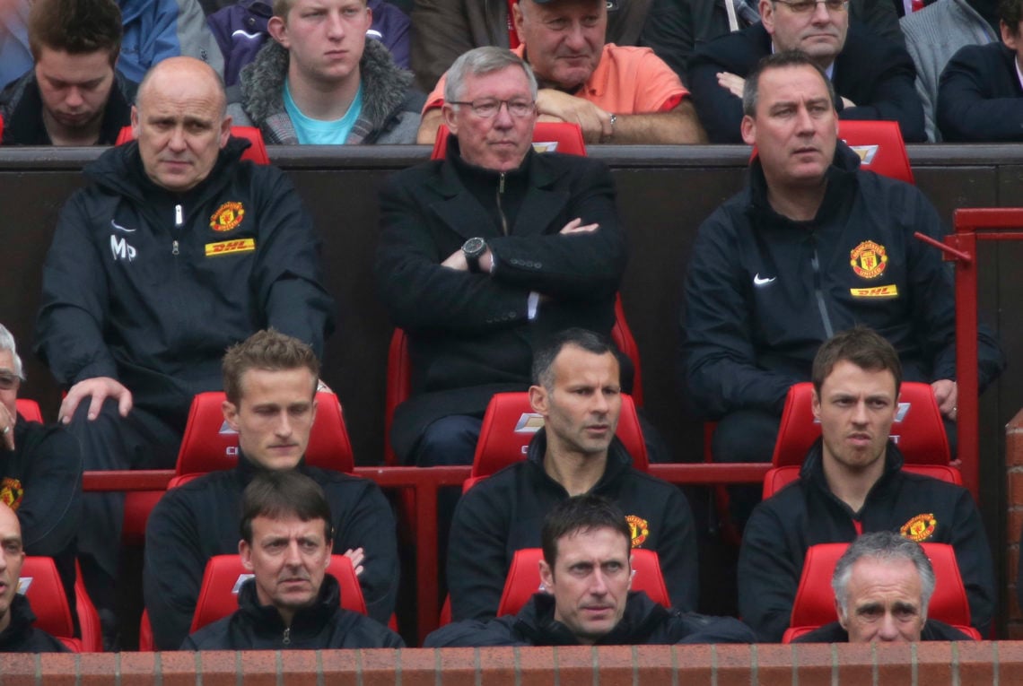 Manager Sir Alex Ferguson of Manchester United watches from the dugout during the Barclays Premier League match between Manchester United and Swans...