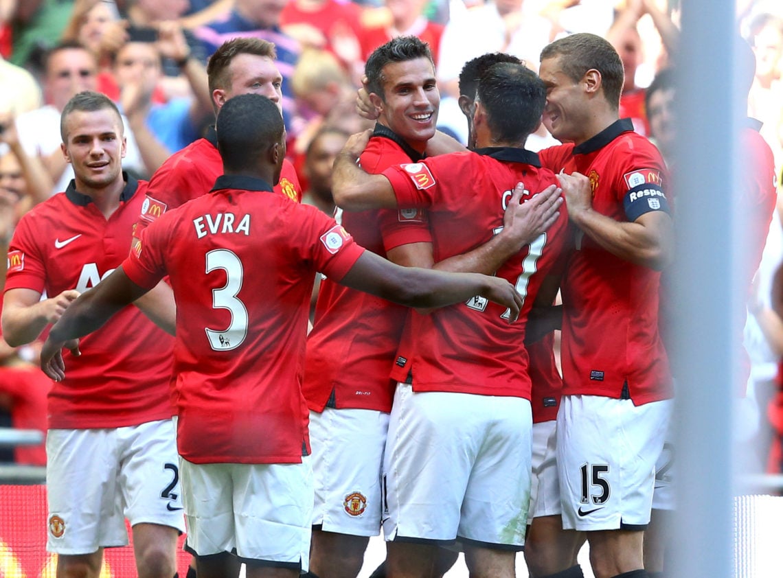 Robin van Persie  (C) of Manchester United celebrates with team-mates Ryan Giggs, Nemanja Vidic and Patrice Evra after scoring their team's second ...