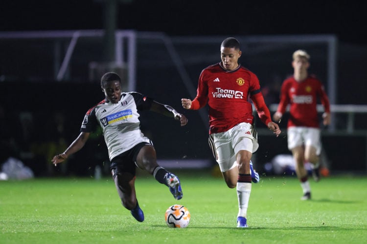 Mateo Mejía of Manchester United U21's is tackled by Fulham U21s Jonathan Esenga during the Premier League 2 match between Fulham U21 and Mancheste...