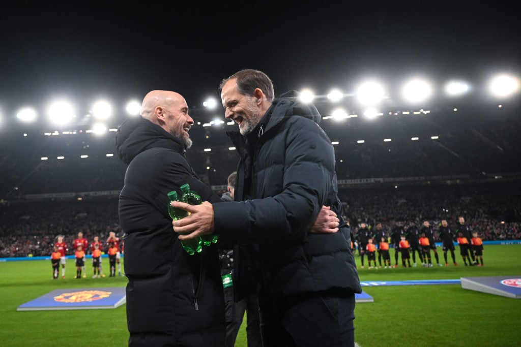 Manchester United manager Erik ten Hag laughs with Bayern Munich manager Thomas Tuchel before the UEFA Champions League match between Manchester Un...