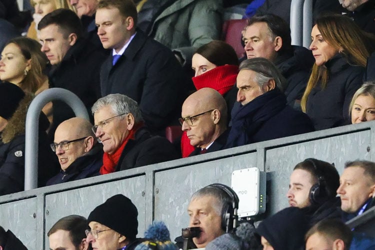 Sir Dave Brailsford (C), Jean-Claude Blanc (R) and David Gill (L) watch on from the stands during the Emirates FA Cup Third Round match between Wig...