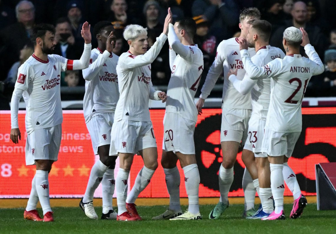 Manchester United's English midfielder #37 Kobbie Mainoo (2L) is mobbed by teammates after scoring the team's second goal during the English FA Cup...