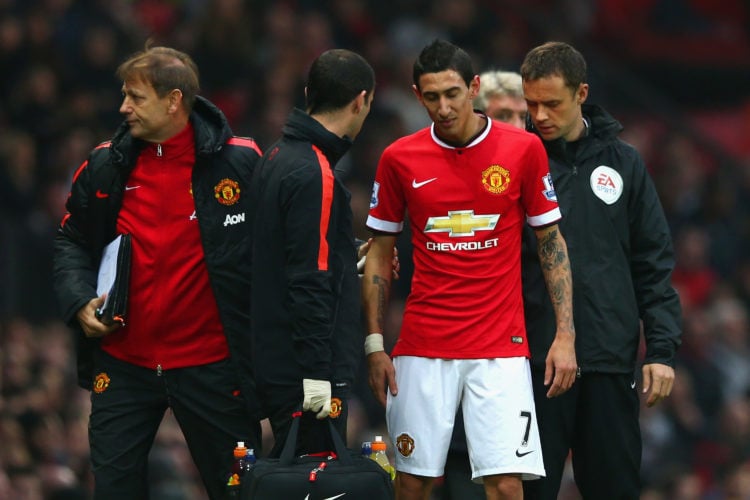 Injured Angel di Maria of Manchester United receives treatment during the Barclays Premier League match between Manchester United and Hull City at ...