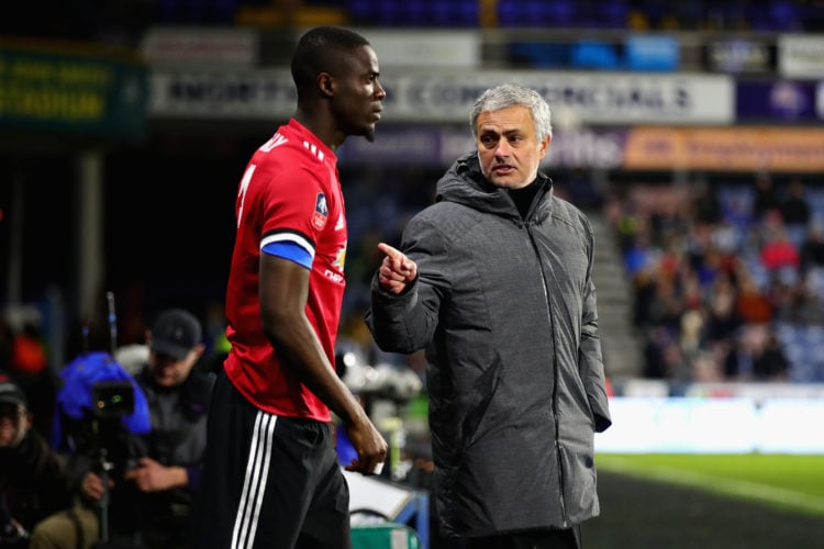 Manager of Manchester United Jose Mourinho talks with Eric Bailly of Manchester United on the sidelines during the Emirates FA Cup Fifth Round matc...