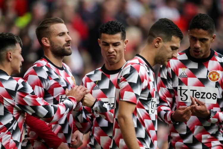 Manchester United's Portuguese striker Cristiano Ronaldo (C) reacts during the warm up prior to the English Premier League football match between M...