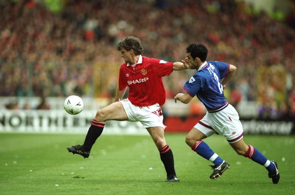 Mark Hughes (left) of Manchester United pushes Craig Fleming (right) of Oldham Athletic during the FA Cup Semi-Final at Wembley Stadium in London. ...