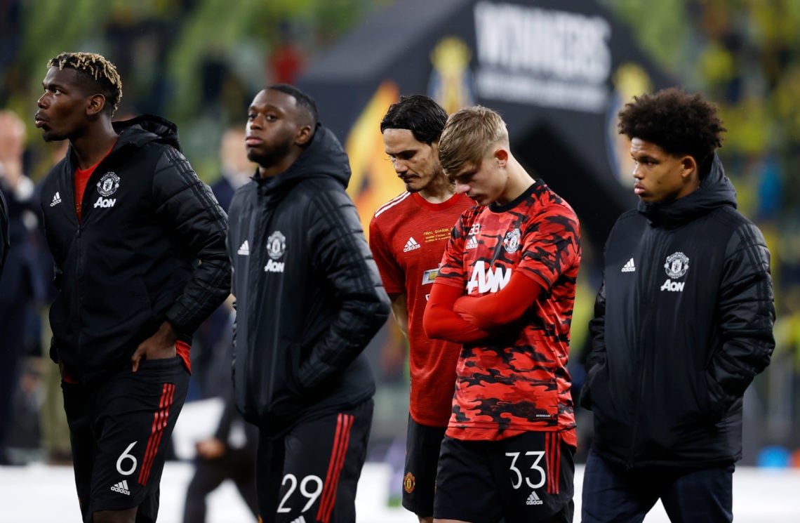 Paul Pogba, Aaron Wan-Bissaka, Edinson Cavani and Brandon Williams of Manchester United stand dejected following the UEFA Europa League Final betwe...