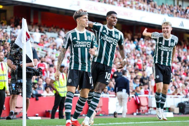 Rasmus Hojlund (R) and Marcus Rashford (C) join Alejandro Garnacho (L) of Manchester United in celebration before his goal is ruled out for offside...