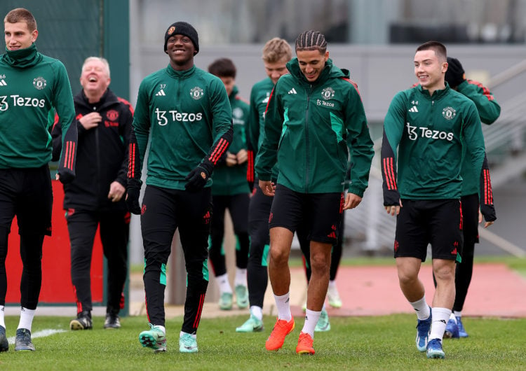 Rhys Bennett, Kobbie Mainoo, Hannibal Mejbri and Dan Gore of Manchester United in action during a first team training session at Carrington Trainin...