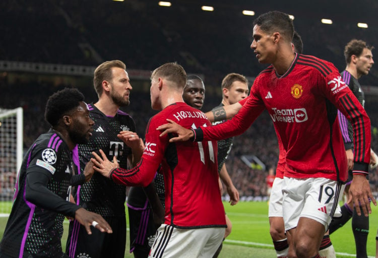 Harry Kane of Bayern Munich is involved in an altercation with Rasmus Hojlund and Raphael Varane of Manchester United during the UEFA Champions Lea...