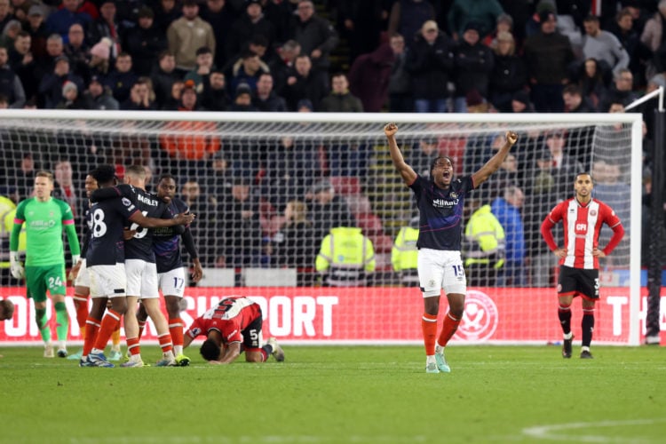 Teden Mengi of Luton Town celebrates victory following the Premier League match between Sheffield United and Luton Town at Bramall Lane on December...