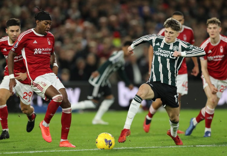 Anthony Elanga of Nottingham Forest and Alejandro Garnacho of Manchester United challenge during the Premier League match between Nottingham Forest...