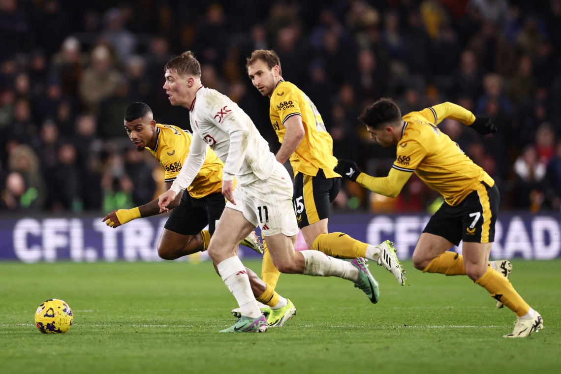 Rasmus Hojlund of Manchester United runs with the ball whilst under pressure from Mario Lemina, Craig Dawson and Pedro Neto of Wolverhampton Wander...