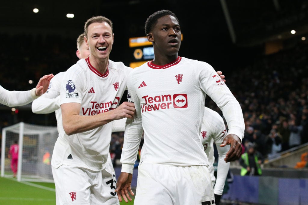 Kobbie Mainoo of Manchester United celebrates after scoring his side's fourth and winning goal during the Premier League match between Wolverhampto...