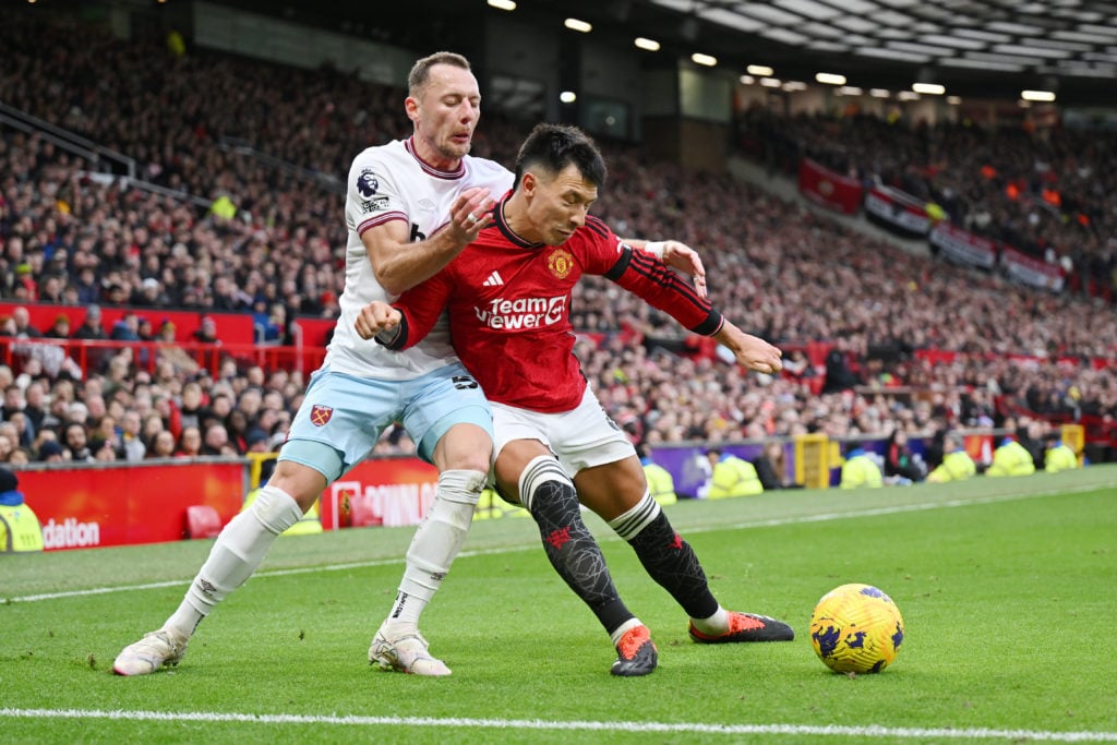 Lisandro Martinez of Manchester United injures his leg in this challenge with Vladimir Coufal of West Ham United battles for possession with during...