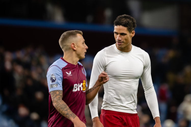 Raphael Varane of Manchester United speaks to Lucas Digne of Aston Villa at the end of the Premier League match between Aston Villa and Manchester ...