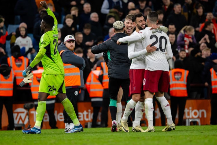 Bruno Fernandes of Manchester United reacts with Diogo Dalot  at the end of the Premier League match between Aston Villa and Manchester United at V...