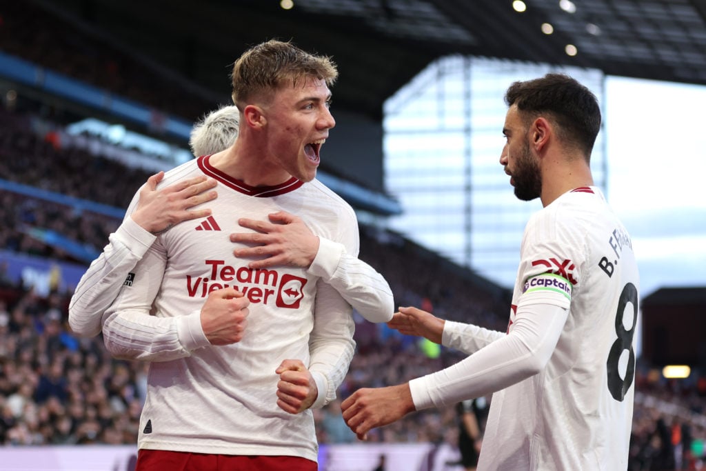 Rasmus Hojlund of Manchester United celebrates with teammate Bruno Fernandes after scoring his team's first goal during the Premier League match be...