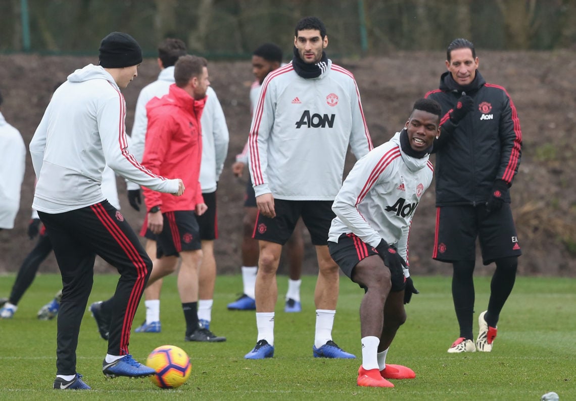 Victor Lindelof, Marouane Fellaini and Paul Pogba of Manchester United in action during a first team training session at Aon Training Complex on De...