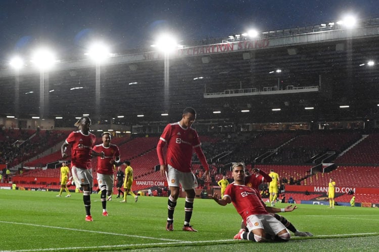 Manchester United's Brazilian midfielder Andreas Pereira (R) celebrates scoring his team's second goal during the English Premier League friendly f...