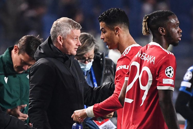 Manchester United's Portugal's forward Cristiano Ronaldo (R) speaks with Manchester United's Norway's coach Ole Gunnar Solskjaer (L) during the UEF...