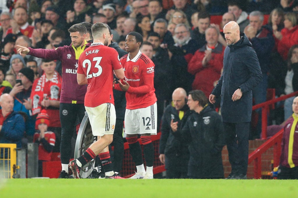 Luke Shaw of Manchester United is substituted off for Tyrell Malacia of Manchester United during the Premier League match between Manchester United...