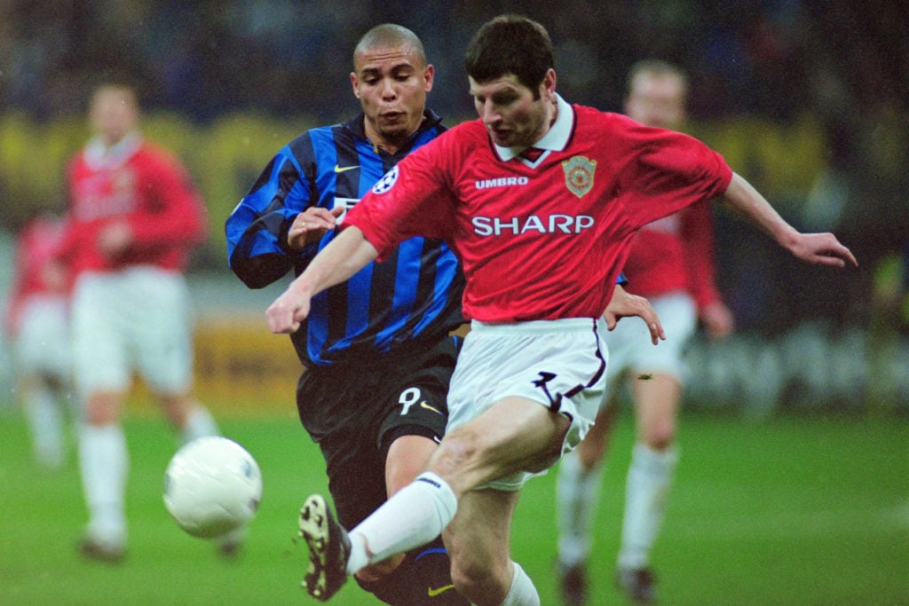 Denis Irwin of Manchester United and Ronaldo of Inter Milan compete for the ball during the UEFA Champions League Quarter Final second leg match be...