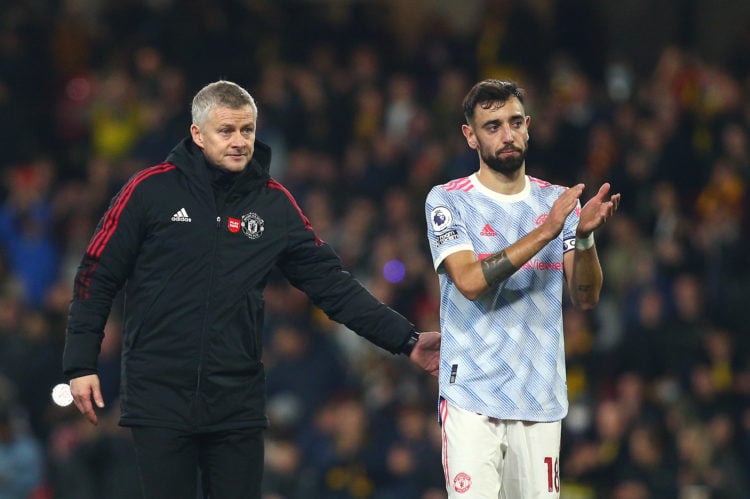 Ole Gunnar Solskjaer, Manager of Manchester United interacts with Bruno Fernandes of Manchester United following the Premier League match between W...