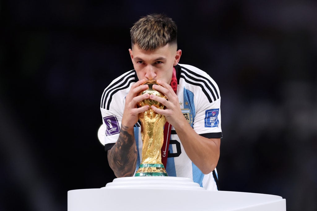 Lisandro Martinez of Argentina kisses the FIFA World Cup winning trophy during the award ceremony following the FIFA World Cup Qatar 2022 Final mat...