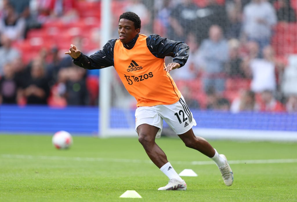 Tyrell Malacia of Manchester United warms up prior to the Premier League match between Manchester United and Fulham FC at Old Trafford on May 28, 2...